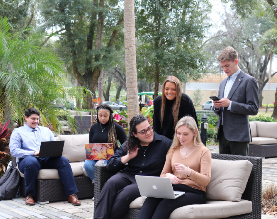Prelaw and Preprofessional students sitting on the lawn